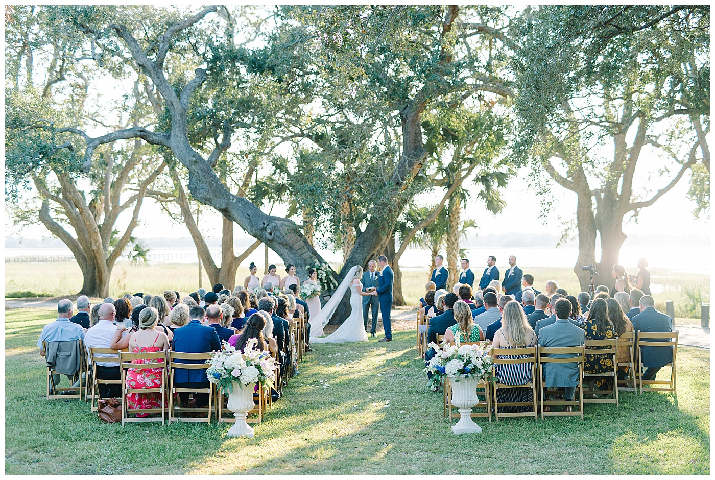 couple getting married under trees