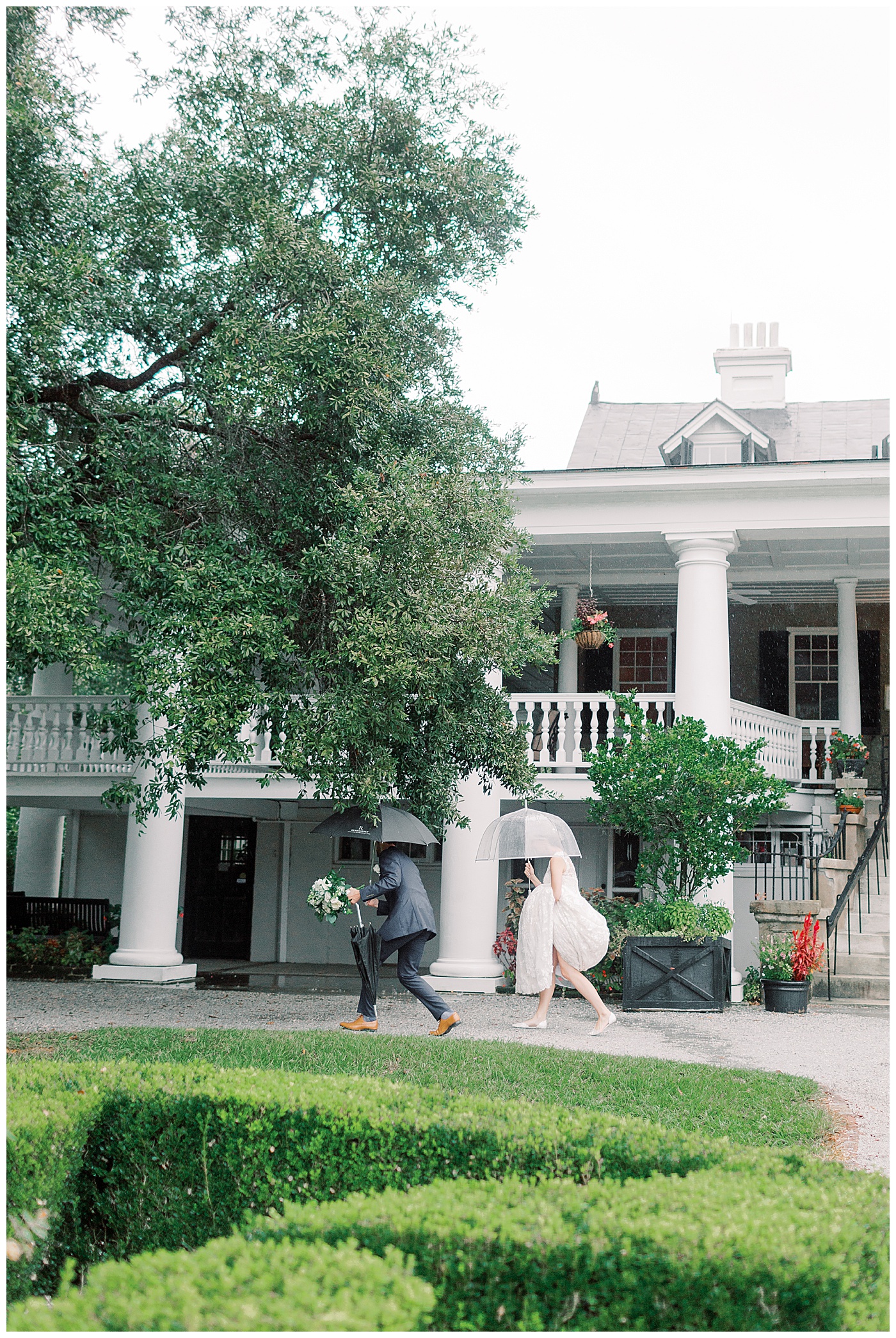 bride and groom running in the rain